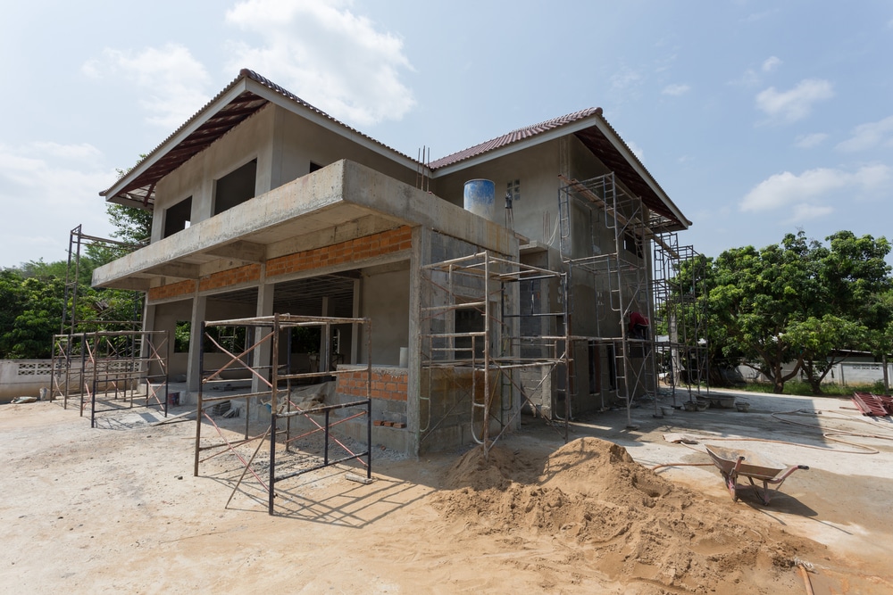 building residential construction house with scaffold steel for